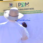 Museveni siging the PDM