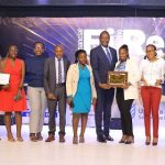 NSSF team led by the Chief Financial Officer pose for a photo with four excellence accolades received at the 2024 Fire awards